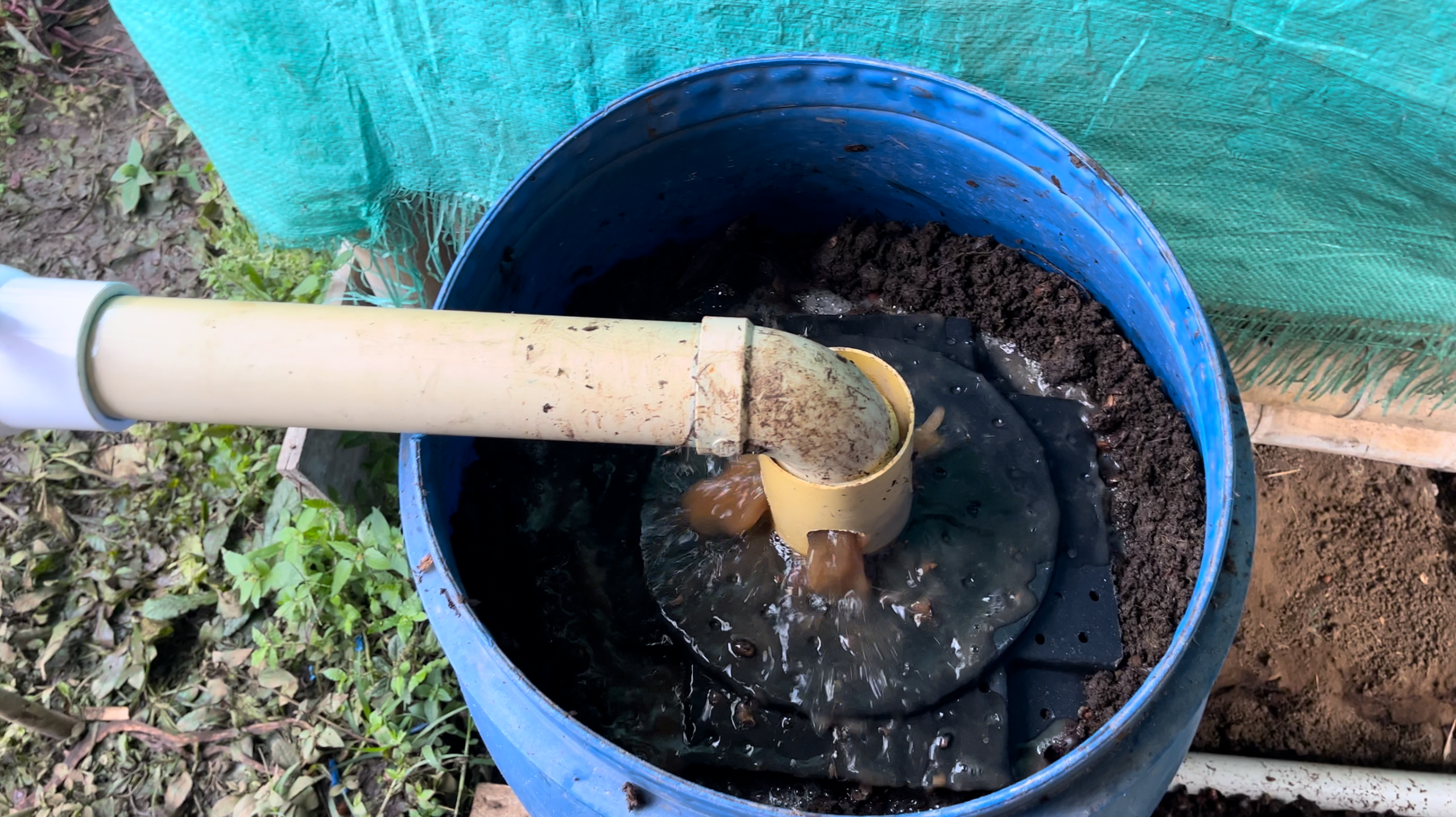 BioBrew filter tank operating on a small coffee farm in Colombia, treating fermentation wastewater on site.